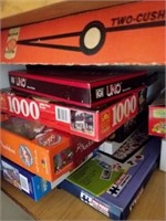 shelf of games/puzzles