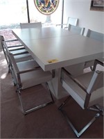 White dining table w/ 8 leather chairs/ 1 leaf