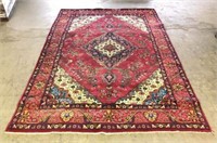 Red, Blue & Tan Area Rug- appears to be handmade