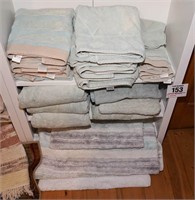 All on bottom 3 shelves - towels & rugs....