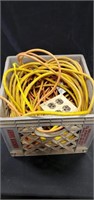 Basket of extension cords and outlet
