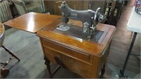 ANTIQUE DOMESTIC SEWING MACHINE IN CABINET