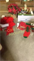 Box of Christmas towels, stockings, bows, hat,
