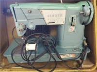 Singer sewing machine in box