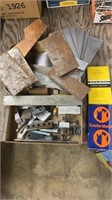 Assortment of scrap metal pieces and two metal