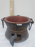Metal and clay warmer