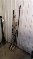 5 assorted hockey sticks. Used, 1 unused. 
4
