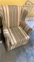 Wingback armchair, striped upholstery with a