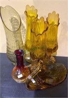 4 Amber glass vases, with an amber glass swan,