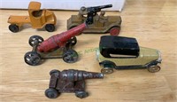 3 Antique toy cars, and two cannons, the yellow