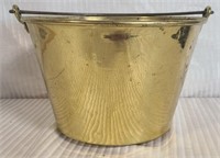 Antique brass bucket with a handle
