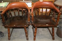 PAIR OF MATCHING LEATHER BOUND BARREL CHAIRS