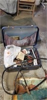 Vintage luggage case with lightbulbs and jumper