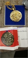 Gold pendant embossed head of Medusa. British