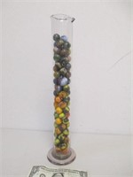 Lot of Assorted Marbles in Lab Measuring Cylinder