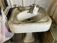 Porcelain sink with faucets