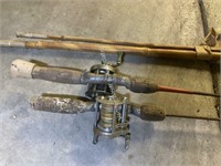 2) Antique open reel fishing poles and cane pole