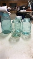 4 colored glass jars