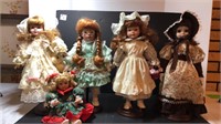 5 porcelain dolls with stands