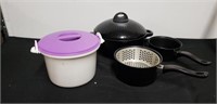 Group of pots and pans with curves container