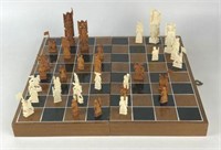 Chessboard with Carved Wood Pieces