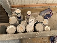 Lot of opened cans of paint