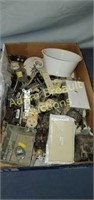 Box of assorted electrical outlets, switches,
