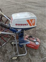 Suzuki 8 Boat Motor w/Suzuki Gas Can & Stand