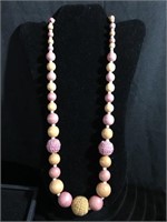 Pink and orange wooden beaded necklace with three