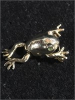 Frog brooch pin with green stoned eyes the frog