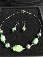 Green stone necklace with matching earrings