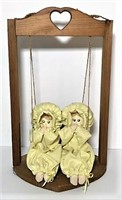 Two Cloth Dolls in Wood Swing