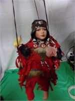 Porceline Native American Doll on a Swing