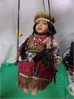 Porceline Native American Doll on a Swing