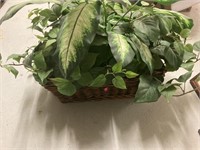 Fake plant in wicker basket
