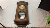 Battery operated wooden hanging clock. 12x28x5
