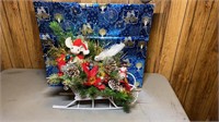 Christmas box and Christmas decorative sleigh.