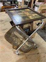 rolling cart with pictures in vintage frames