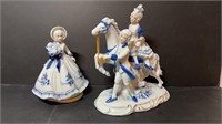 Porcelain figurines, girl has a music box and