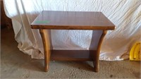 Wooden end table.
24 in h x 19 in w x 16 in l.