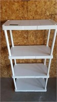 White plastic shelving unit. 4 shelves.
24 in w
