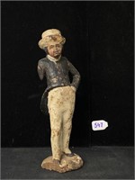 Man in cape figurine