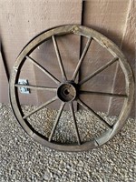 28” wagon wheel made of wood and iron.  Width of