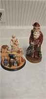2 collectible Santa Claus figurines