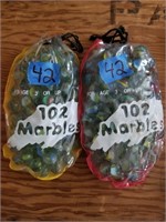 2 Drawstring Bags Of Glass Marbles