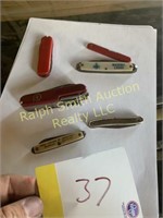 6 knives, some advertisement