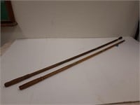 Two wooden gun cleaning rods