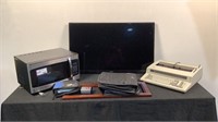 TV, Microwave, Printer, and CD Cases