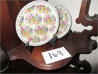 2 decorative plates and holders