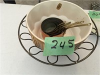 copper measuring cups, serving bowl, wire basket